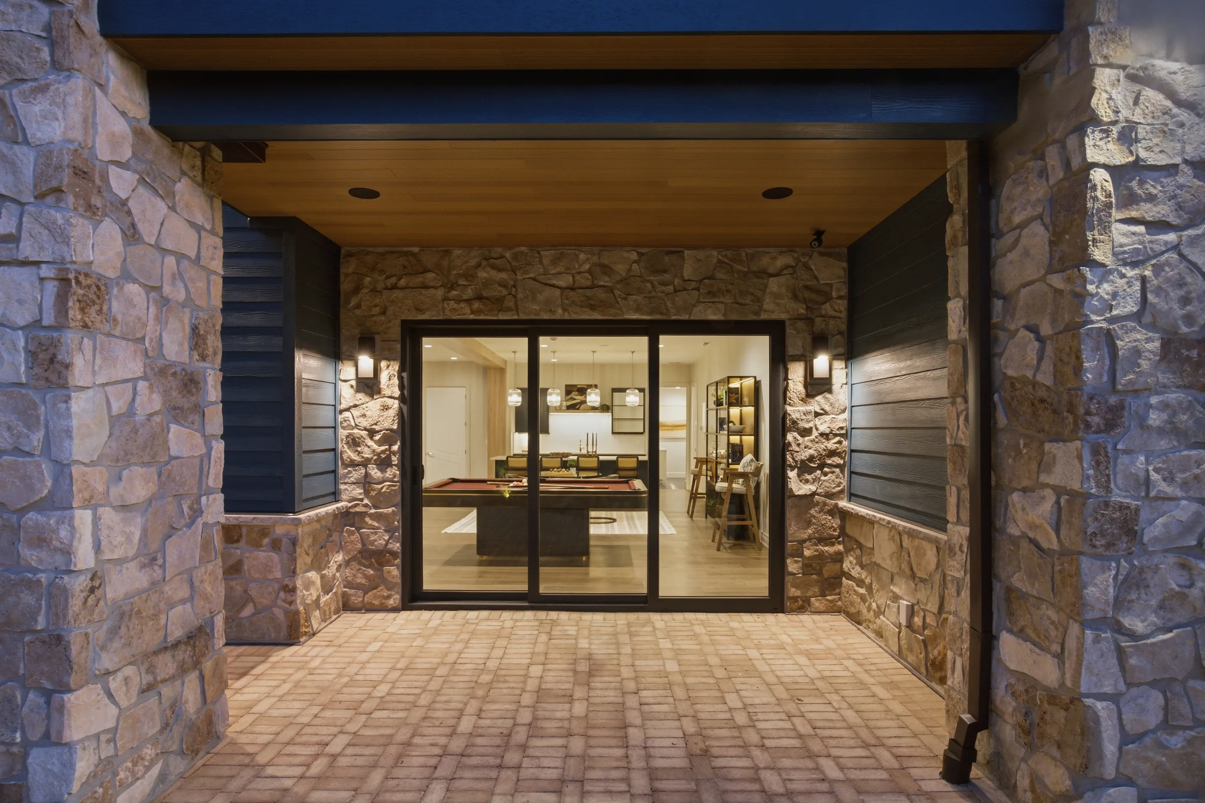 Finished glazed doors in a covered exterior passage