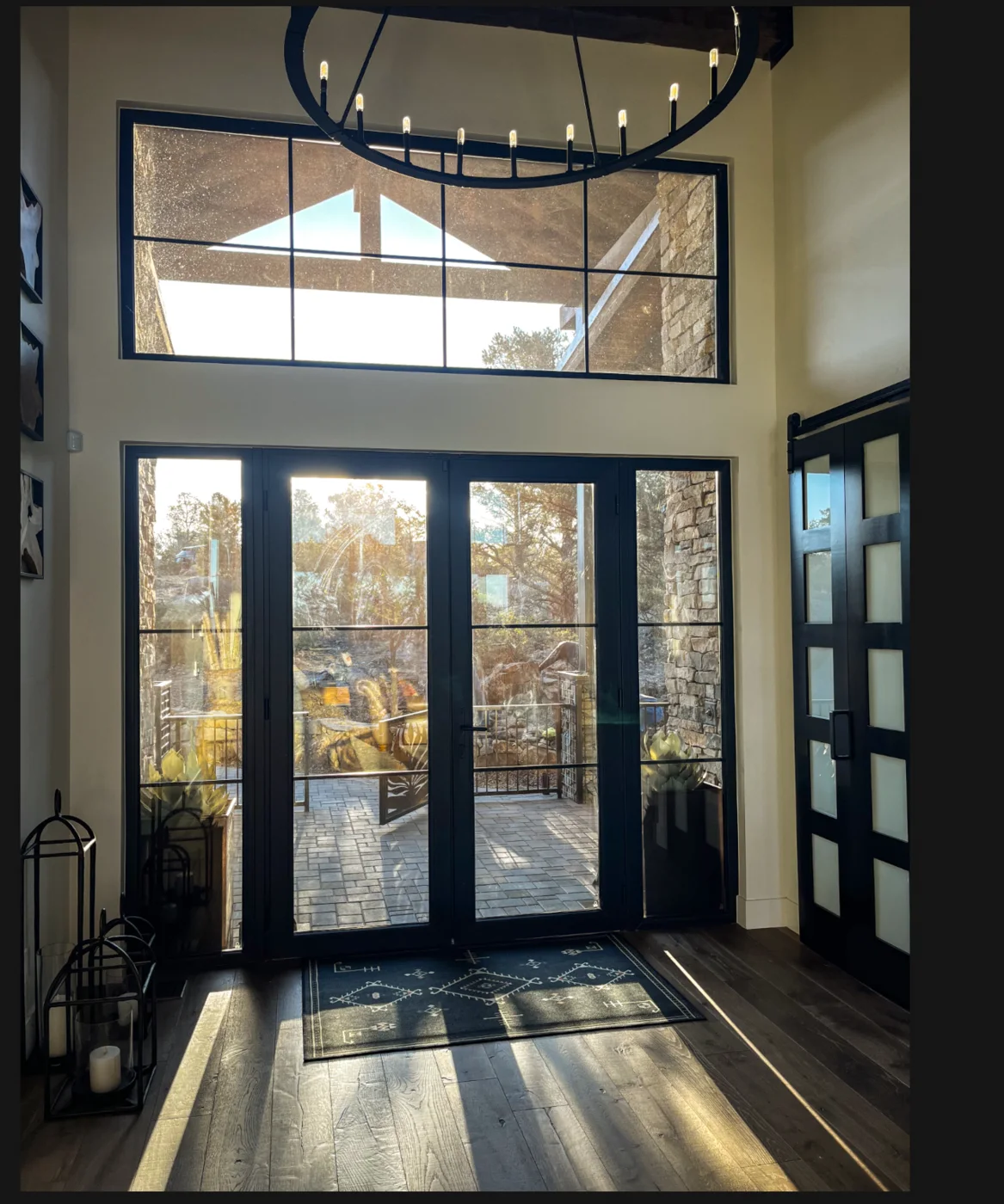 Sunlit glazed entry with views of the high-desert landscape