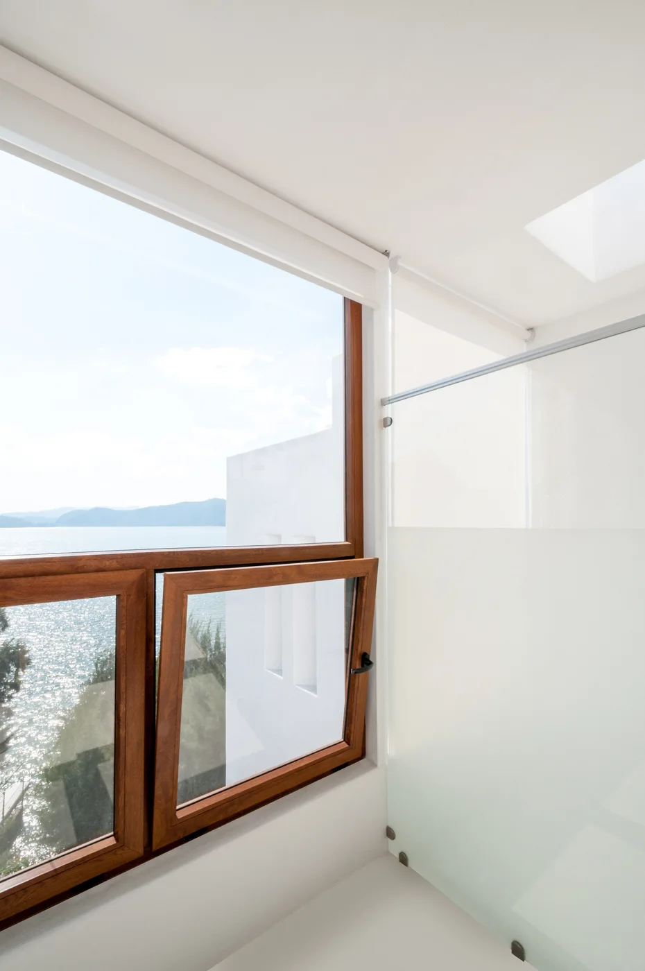 Tilt-and-turn window set into a contemporary wall